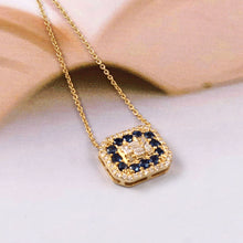 Load image into Gallery viewer, 14K YELLOW GOLD, DIAMOND & BAGUETTE AND BLUE SAPPHIRE CHAIN PENDANT