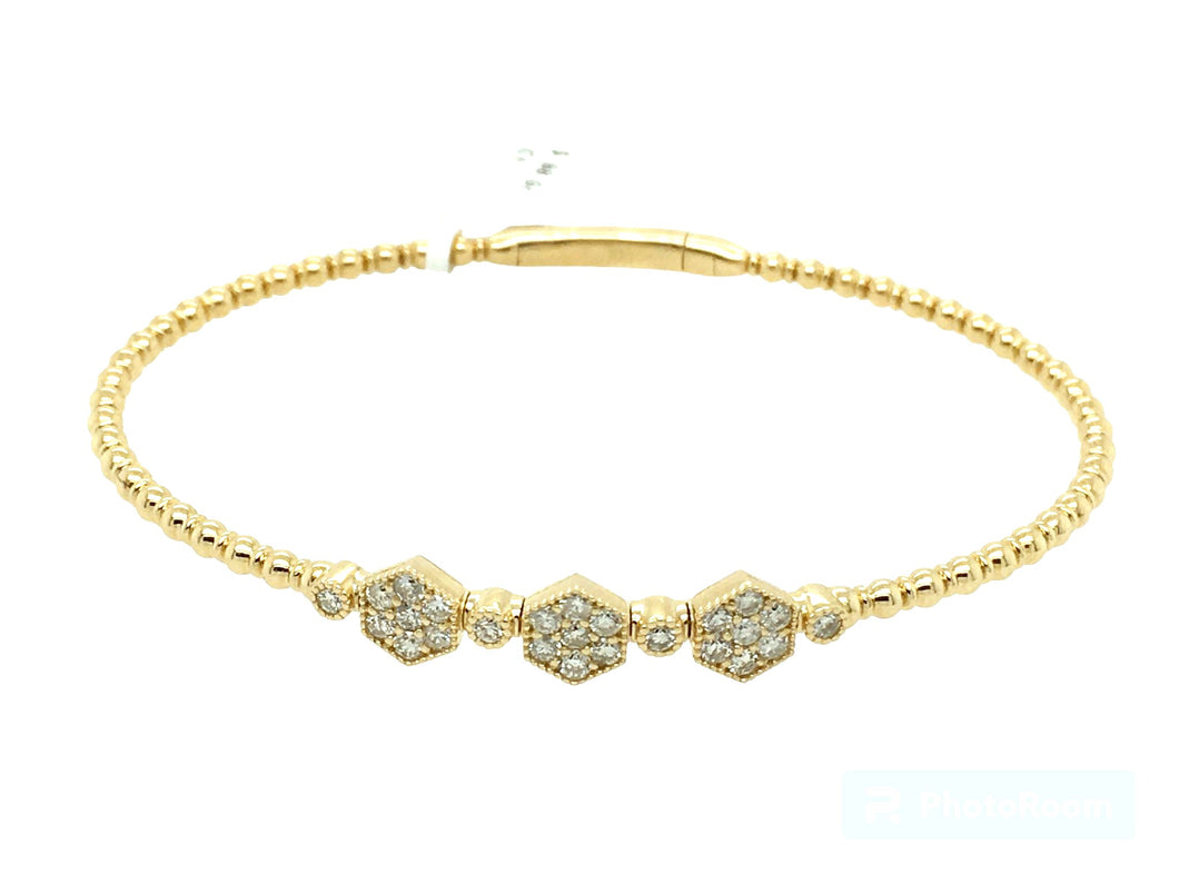 0.60Ct diamond and 14k yellow gold bangle.