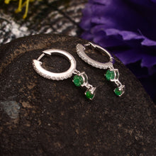 Load image into Gallery viewer, 0.20 CT DIAMOND &amp; 14K WHITE GOLD WITH EMERALD HUGGIE HOOP EARRING
